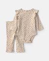 Conjunto 2 peças, body floral e calças em creme