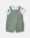 Two-piece cotton set with short overalls and dinosaur design T-shirt