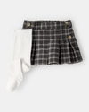 Conjunto falda con leotardos estampados
