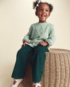 Sweater with argyle vest and plaid sleeves, green